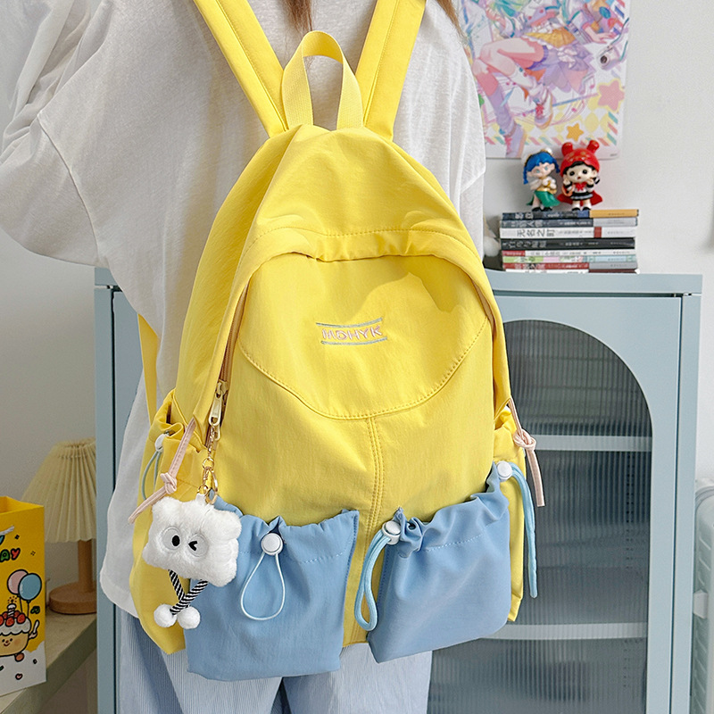 A new Japanese-style ins fresh and sweet color-blocking backpack, a casual, lightweight and large-capacity backpack for junior and senior high school students full figure