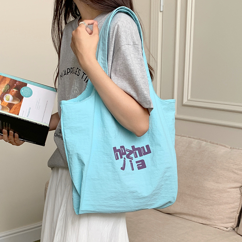 New student casual canvas bag, trendy women's underarm bag, hand-purified color casual, lightweight and large-capacity tote bag full figure
