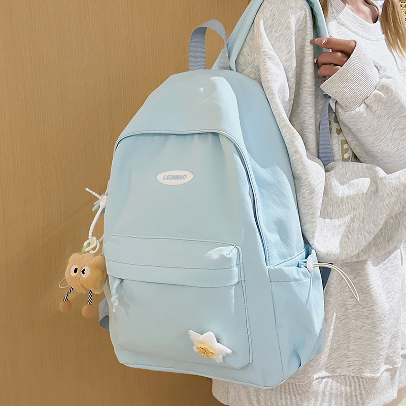 A new high-appeartion-level, fresh and cute backpack with a college style. It is a casual, simple, lightweight and versatile backpack for middle and high school students full figure