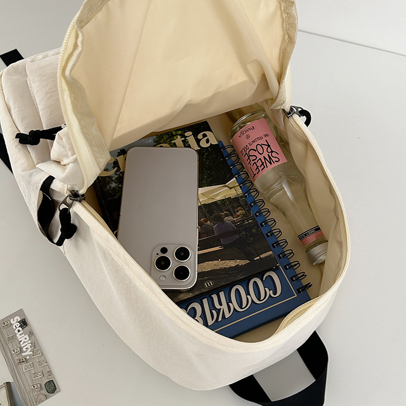 A new Korean-style Instagram backpack with a high level of appearance, fresh and sweet. It is a simple and large-capacity backpack in solid colors for junior and senior high school students Application Scenario