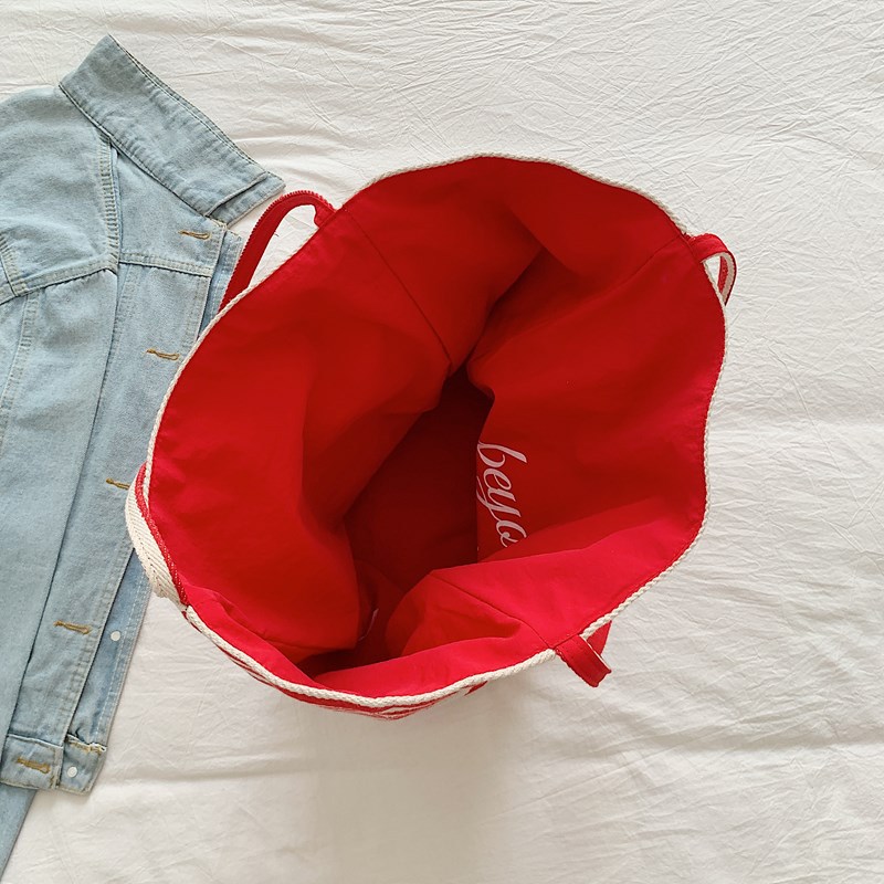 Double-sided backpack with stripes, a niche Korean version, large-capacity, laid-back red tote bag, a casual shopping bag for women Application Scenario