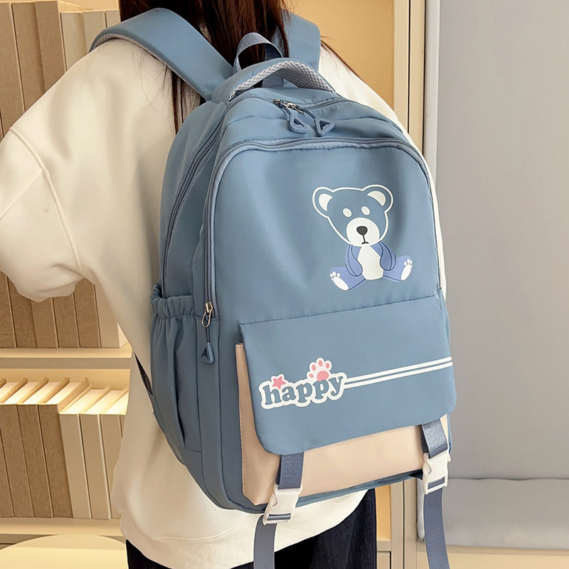 The new forest-themed ins fresh solid color backpack is a casual, simple and lightweight large-capacity backpack for high school and junior high school students to attend classes full figure