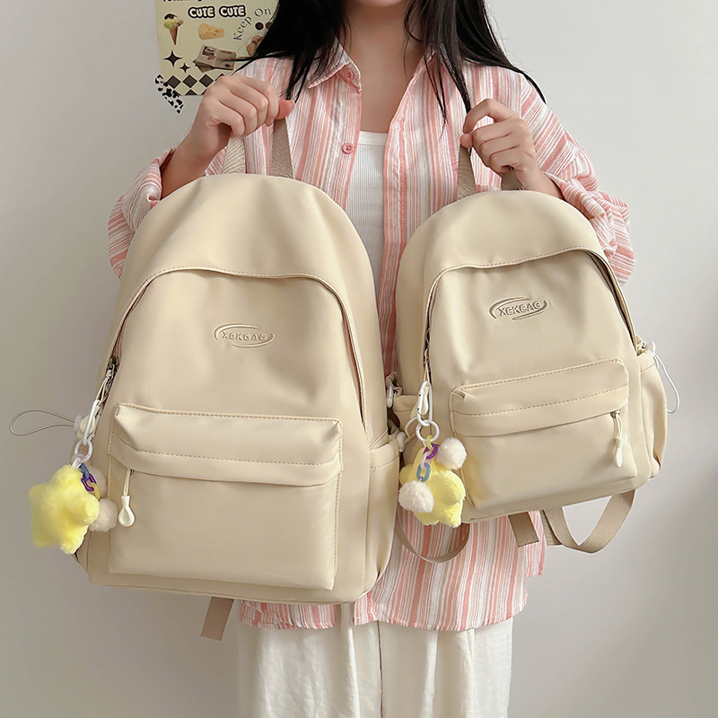 This is a lightweight, simple and versatile backpack for female college students, featuring a casual and girlish style. It is also a Korean-style Instagram backpack for junior and senior high school students full figure