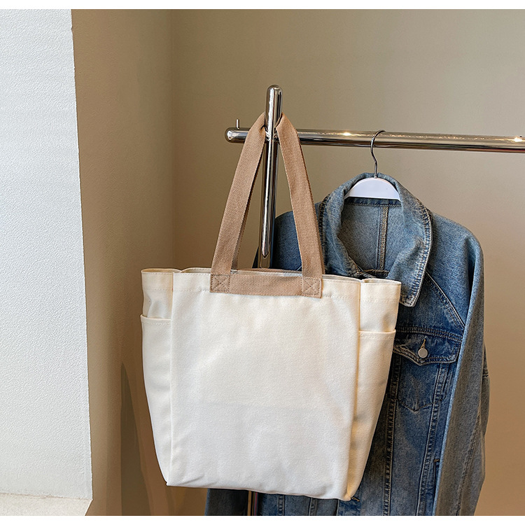 Solid-color lettered, artistic and laid-back style single-shoulder bag, simple commuting and school canvas bag, casual and versatile new tote bag Application Scenario