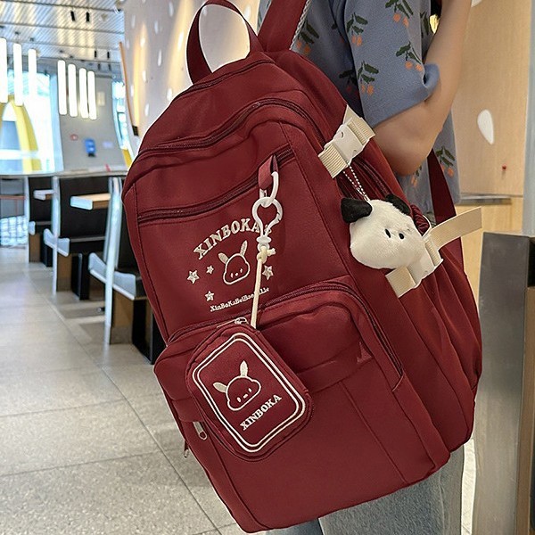The new high-appearancelevel printed cute rabbit backpack is a casual, simple, lightweight and versatile backpack for high school and junior high school students, suitable for commuting full figure