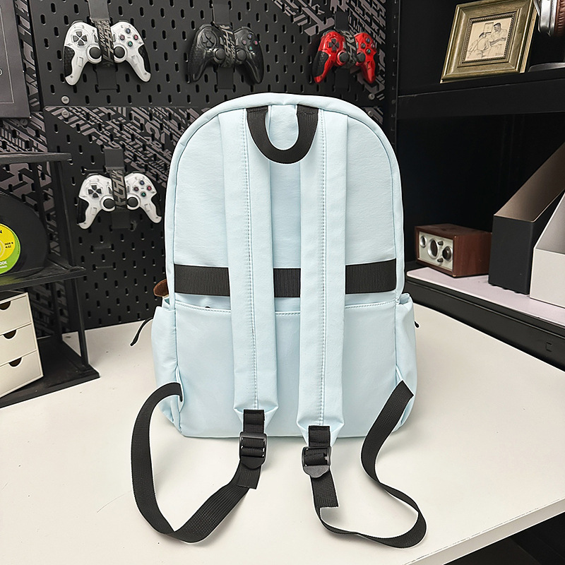 Korean version couple simple large-capacity backpack, casual commuting college student schoolbag, niche lightweight travel backpack Application Scenario