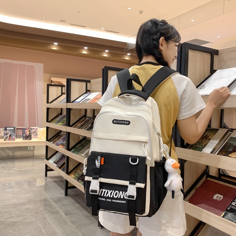The 2025 new large-capacity, color-blocking, fashionable, multi-layered backpack for junior and senior high school students is versatile, simple and casual details Picture