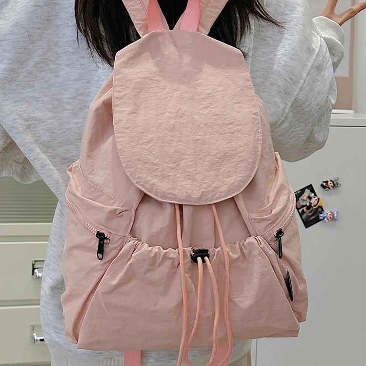 A new Korean niche lightweight nylon fabric backpack for girls, a casual and fashionable drawstring travel backpack with large capacity Application Scenario