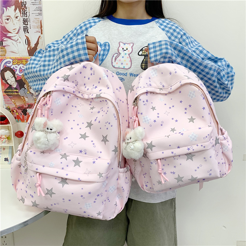 The new forest-themed ins high-appearance-level fresh, sweet and cute star backpack is a light and simple backpack for junior and senior high school students full figure