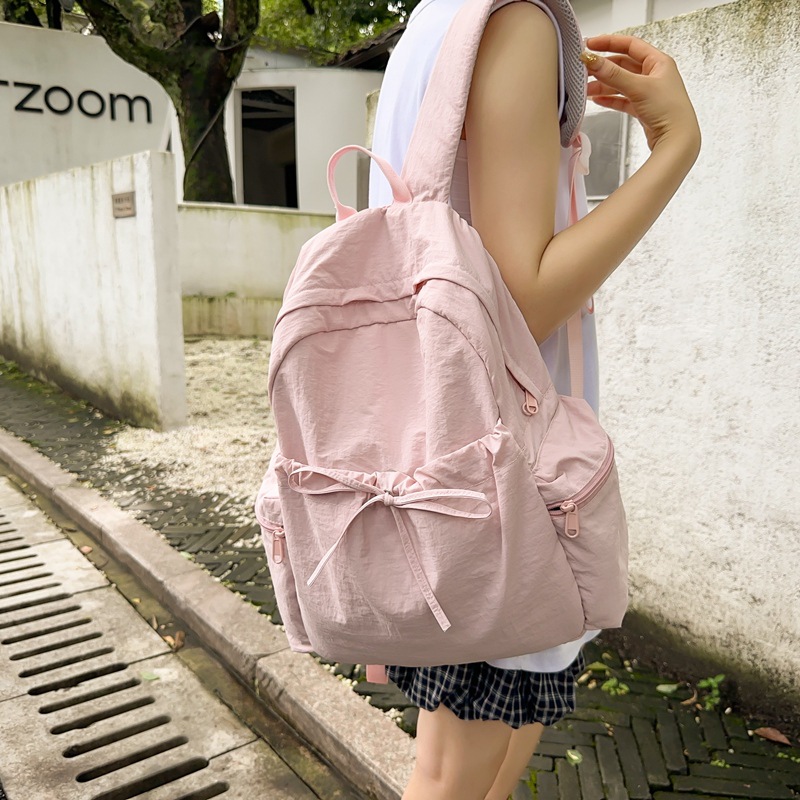 A new minimalist backpack with a Korean niche design, versatile travel backpack, lightweight solid color and large capacity student schoolbag details Picture