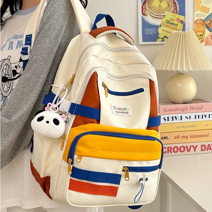 A new 2024 Korean-style, fresh and color-blocking backpack for women, a large-capacity travel backpack, and a school bag for college students full figure