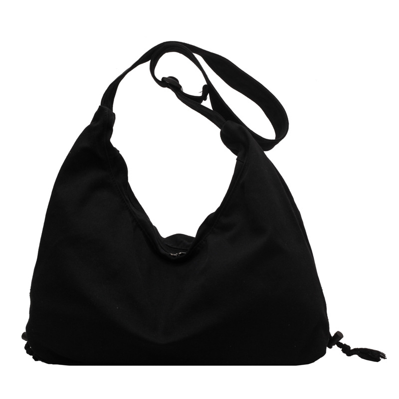 This crossbody bag is a dual-purpose bag for female college students' classes. It features an ins style, a large capacity solid color canvas commuting single-shoulder bag from Japan and South Korea Item Picture