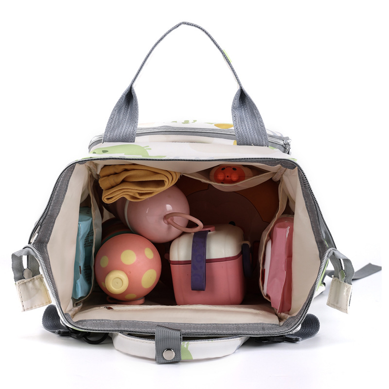 The new mommy bag for foreign trade, a fresh hand-held backpack, has a large capacity and is lightweight for going out. It can be used to hang baby strollers Application Scenario