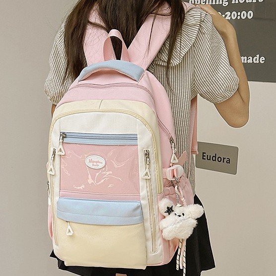 A new high-appeal Japanese-style ins fresh and sweet color-blocking backpack for junior and senior high school students, a casual and lightweight backpack details Picture