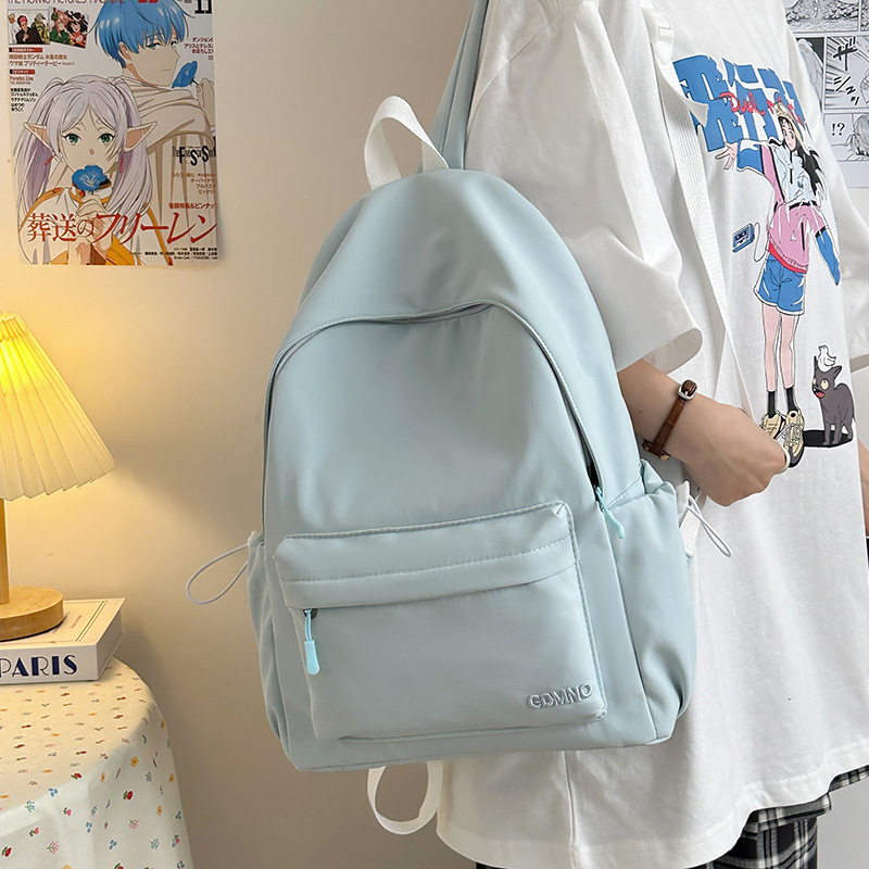 A new Korean-style backpack with a high level of appearance. It is a casual, simple, commuting, fashionable and versatile large-capacity backpack for middle and high school students full figure