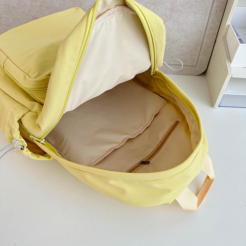 Cute primary school student backpacks, transparent schoolbags with a college style, solid-color smudged pain bags, simple and niche backpacks for junior and senior high school students Application Scenario