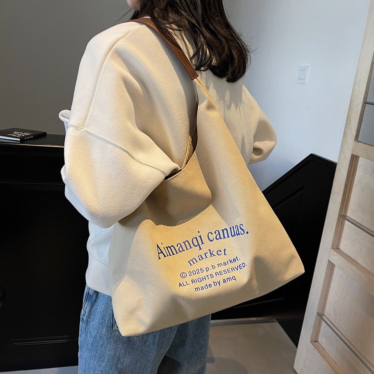 Korean-style artistic and laid-back letter single-shoulder canvas underarm bag 2025 new casual, fashionable and versatile student tote bag full figure