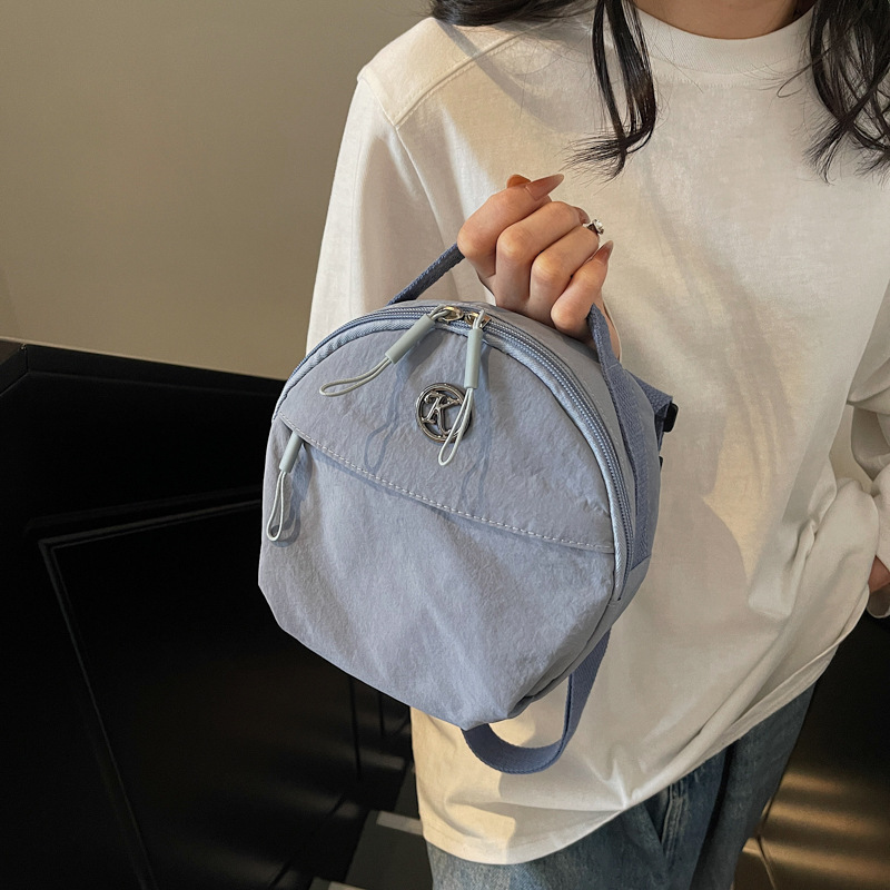 The 2025 new high appearance level small round bag is sweet and versatile. It is suitable for commuting and traveling, and can be carried diagonally on one shoulder in macaron color Application Scenario