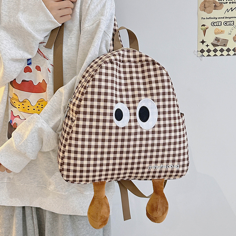A cute and fresh checkered schoolbag for girls, a cute and ugly cartoon backpack for a small group of students, a lightweight backpack for girls full figure