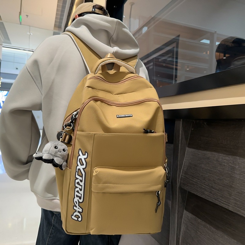 Spring new simple and large-capacity couple casual backpack, high appearance level Korean-style trendy backpack for junior and senior high school students full figure