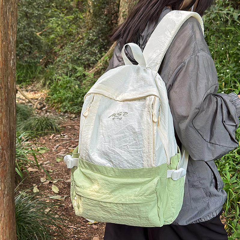 A new high-appearance-level, fresh and sweet color-blocking backpack from Forest-themed ins, a lightweight travel backpack for junior and senior high school students details Picture