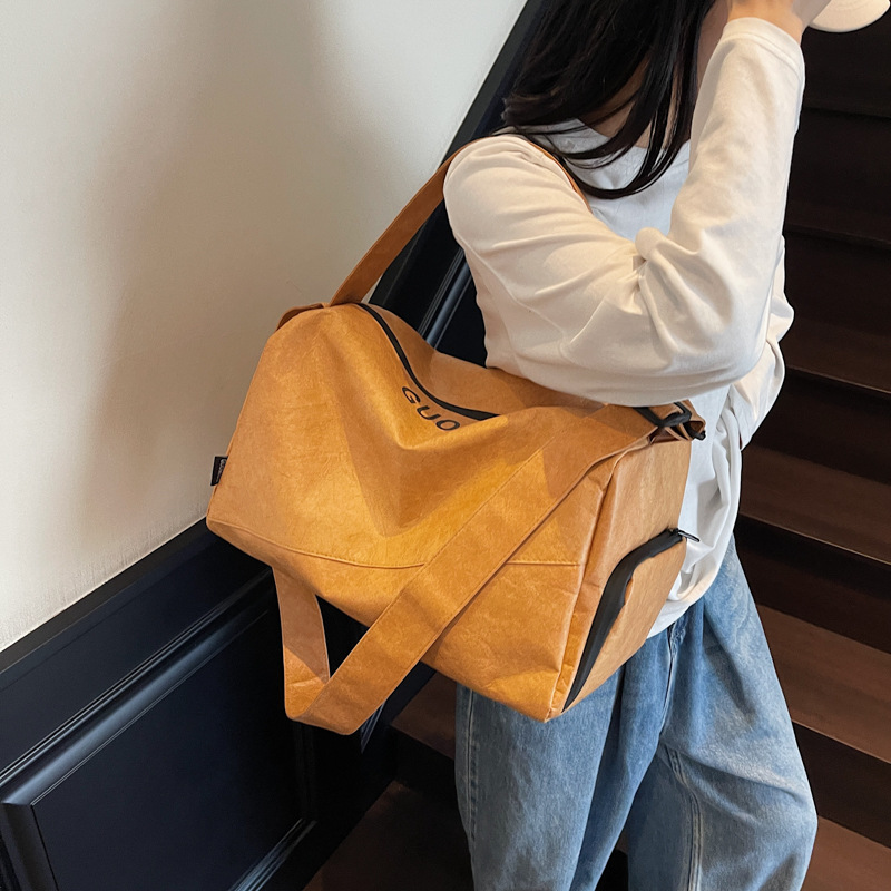 A new high-appeartion-level solid-color hand-held tote bag for women, a casual, simple and lightweight outdoor camping large-capacity crossbody bag details Picture