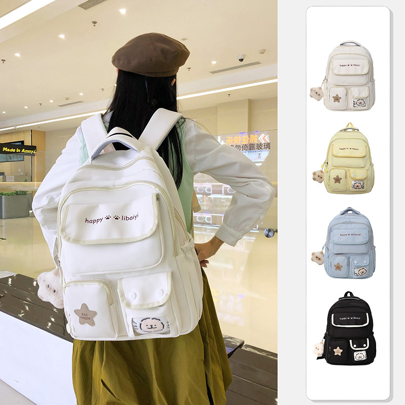 Wholesale of pure color backpacks for female junior high school students with a fresh and simple Korean school style and multi-layered design full figure