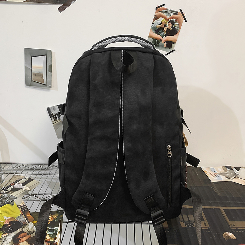A large-capacity, trendy and casual college student couple backpack with a Korean college style and lettered travel backpack Specification drawing