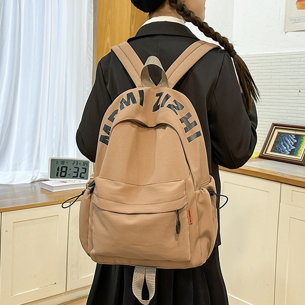 2025 New style simple letter backpack for middle school students, Japanese trendy brand college student couple travel backpack full figure