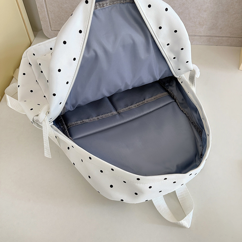 This is an ins style backpack that is versatile and has a high level of appearance. It is a polka dot Korean-style girl's backpack that is lightweight and suitable for junior high school and college students' travel Application Scenario