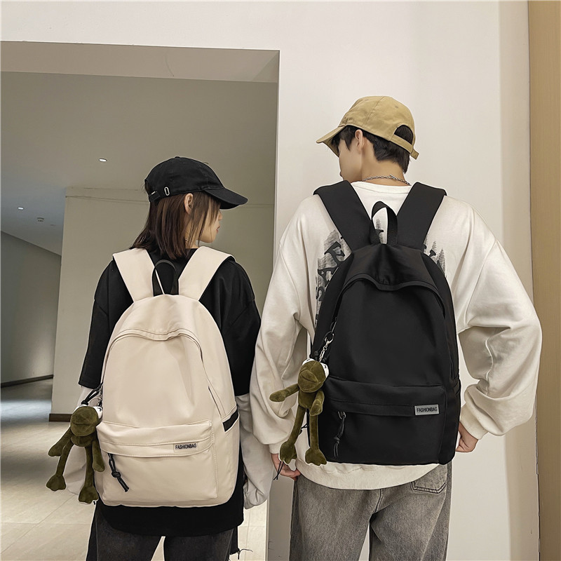 A simple and large-capacity travel backpack for men, a casual backpack for women, and a schoolbag for junior high school, high school and college students from Japan and South Korea full figure