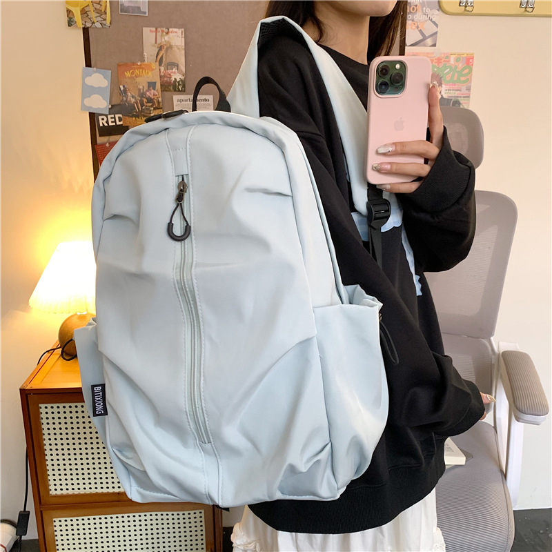A new Korean-style Instagram backpack with a high aesthetic level and niche design. It is a simple and large-capacity backpack in solid colors for junior and senior high school students details Picture
