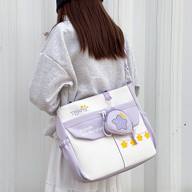 Large-capacity school-style single-shoulder bag for female primary school students to carry books for class tutoring. High appearance level and cute star-shaped crossbody bag full figure