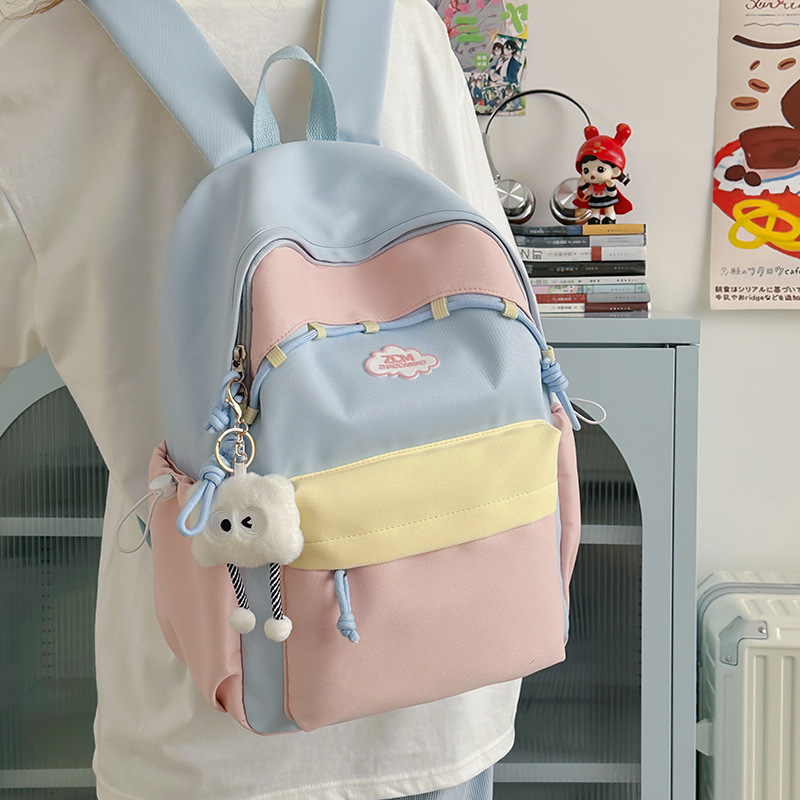 A new high-appearance-level Japanese ins fresh and sweet candy-colored backpack, a lightweight mini backpack for junior and senior high school students full figure