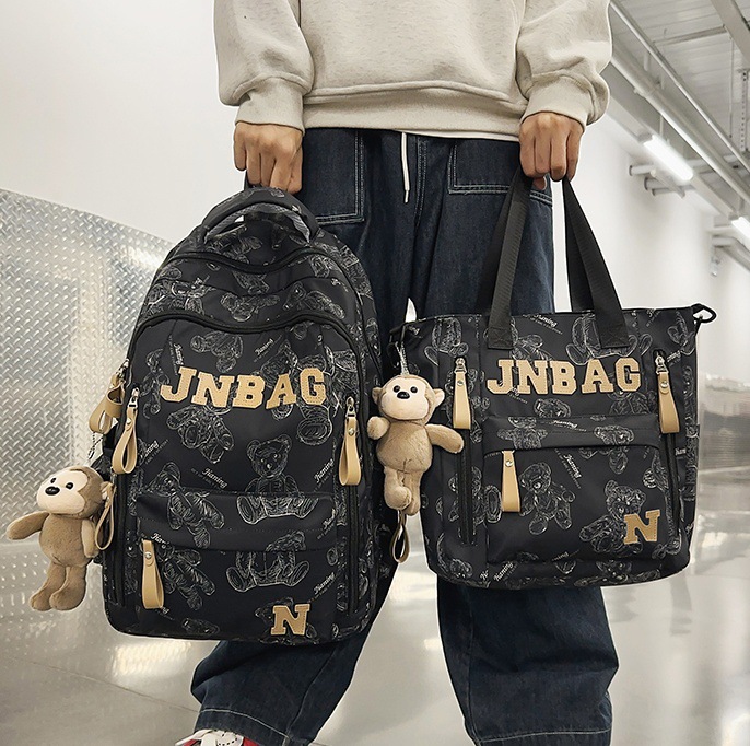 A new trendy large-capacity backpack with bear prints for junior high school students and a couple computer bag for college students full figure