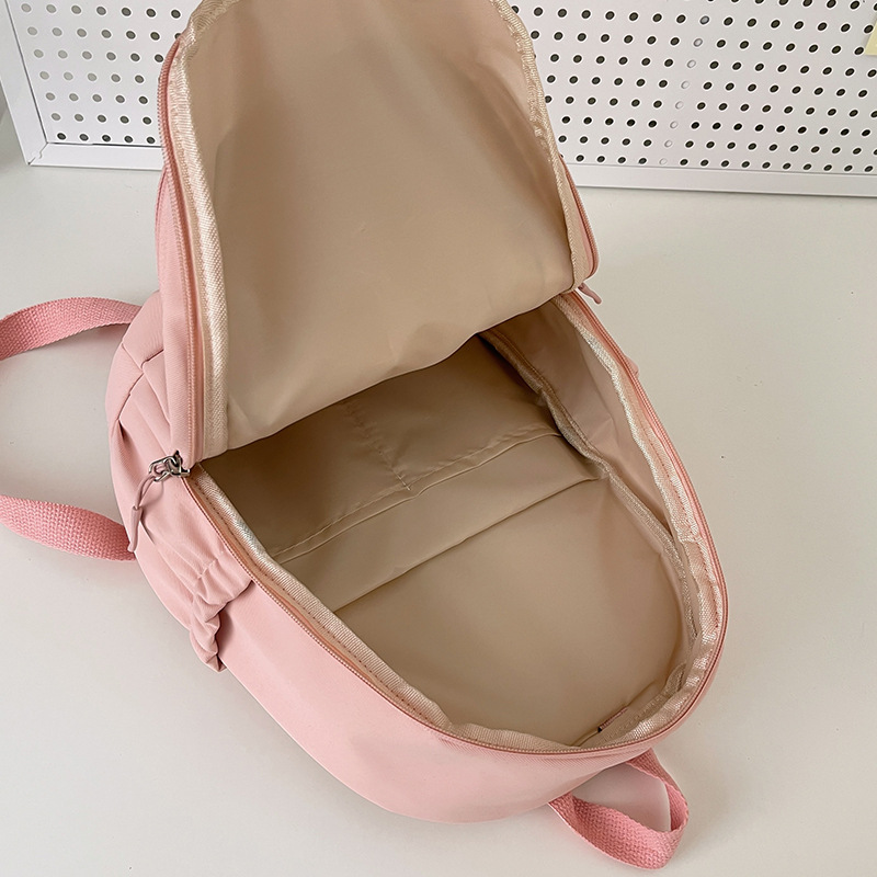 The new schoolbag is a simple solid-color small backpack for female college students. It features a Japanese Instagram style, a soft and cute girl, and mini shoulders Application Scenario