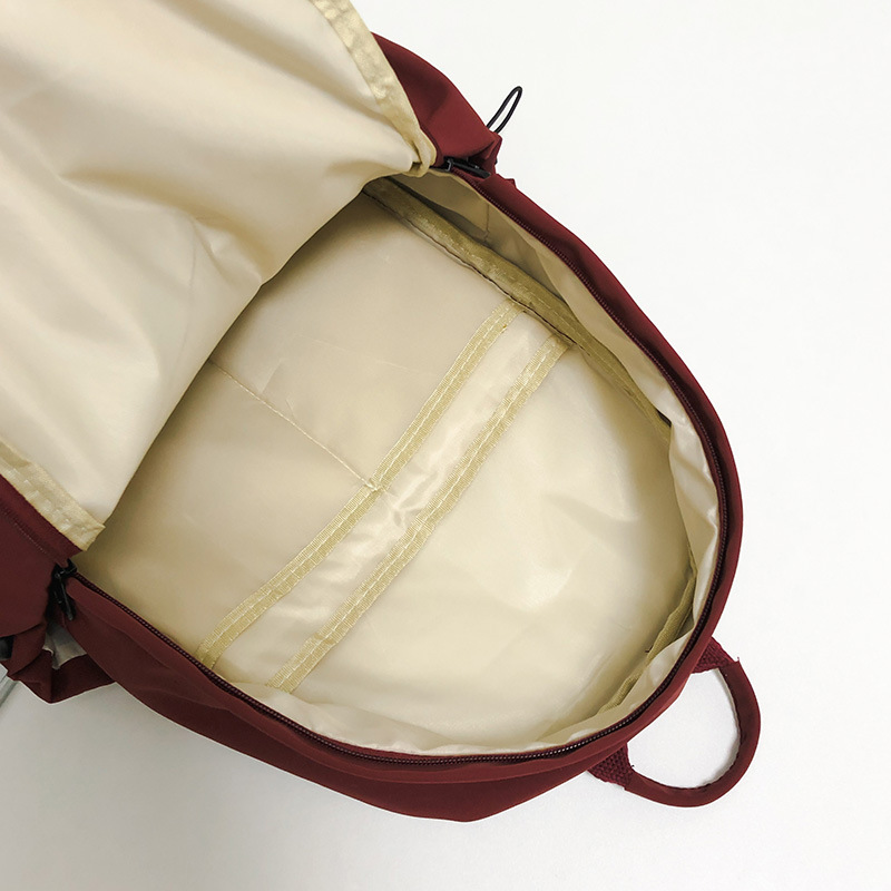Solid-color schoolbag for female college students, simple and ins-style Korean backpack, high appearance level backpack for female junior and senior high school students Application Scenario