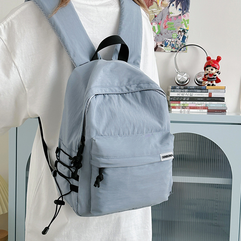 A new Korean-style Instagram backpack with a high level of appearance, fresh and sweet. It is a simple and large-capacity backpack in solid colors for junior and senior high school students full figure