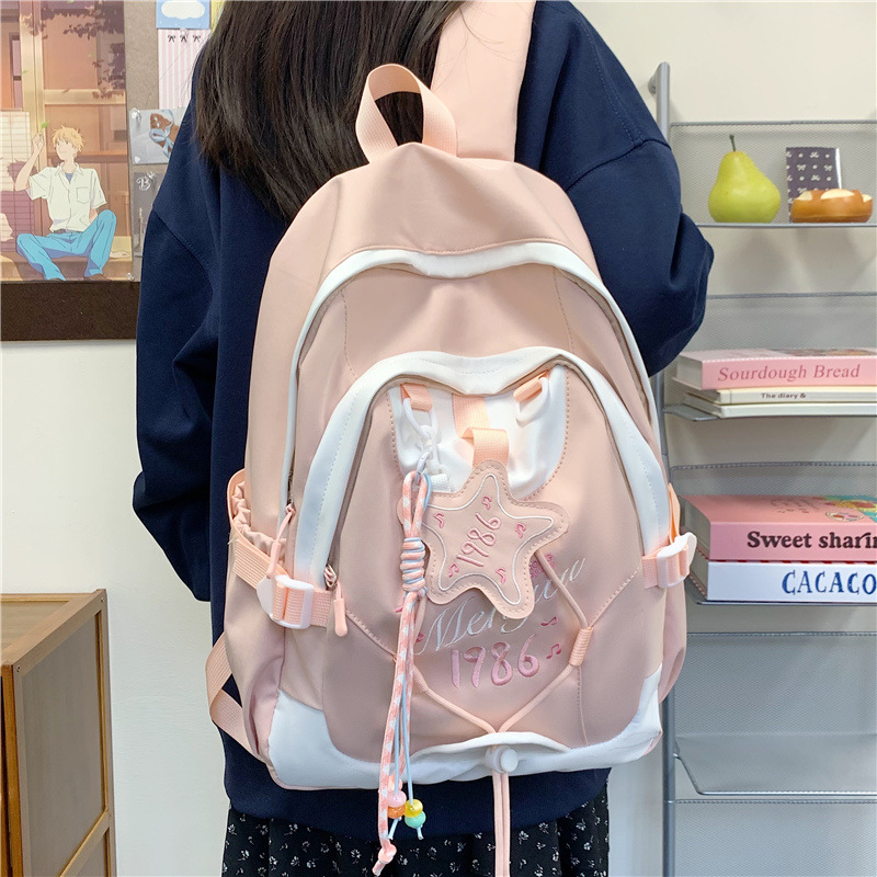 A new Japanese-style backpack with a high aesthetic level and a fresh and sweet school style. It is a lightweight and large-capacity backpack with contrasting colors for junior and senior high school students details Picture