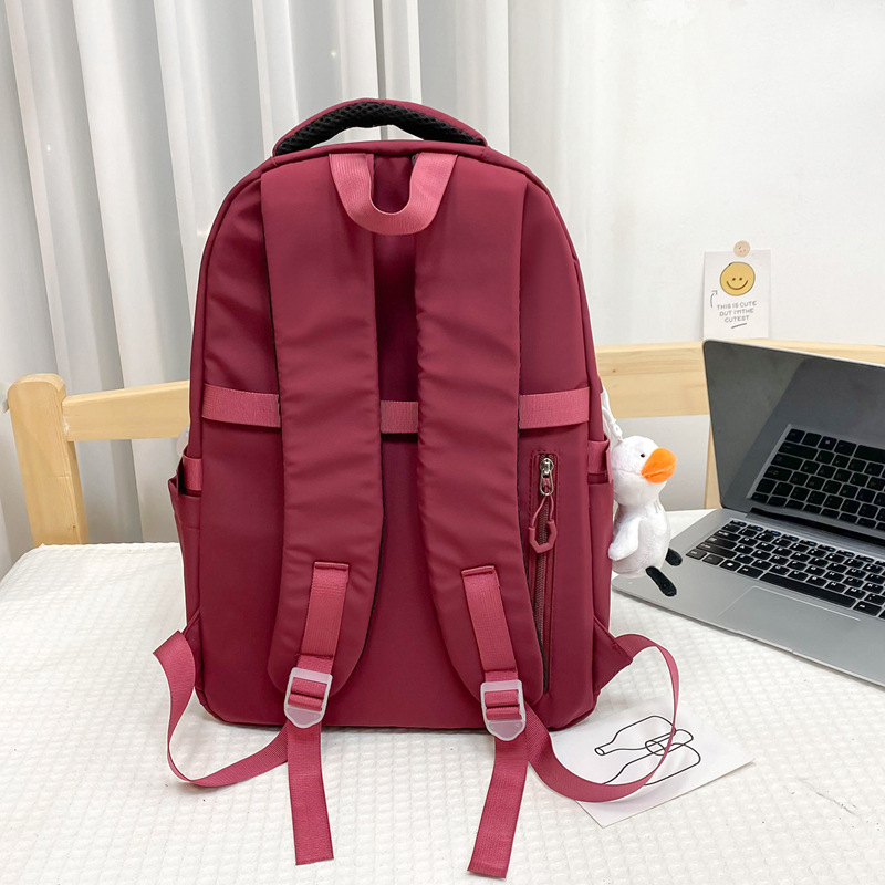 A new Korean style Instagram trendy couple's casual travel backpack with multiple compartments for primary and secondary school students Specification drawing