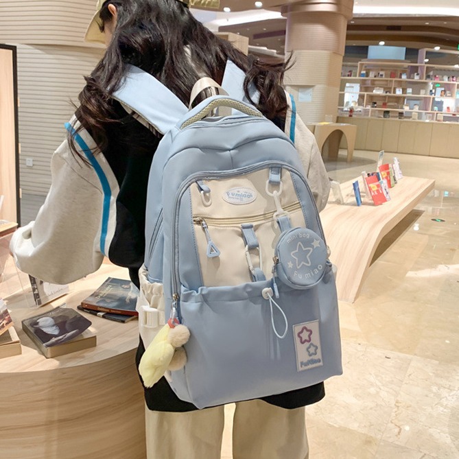A new Korean-style ins school-style versatile and cute backpack with a color-blocking and patchwork design, a lightweight backpack for primary and secondary school students details Picture