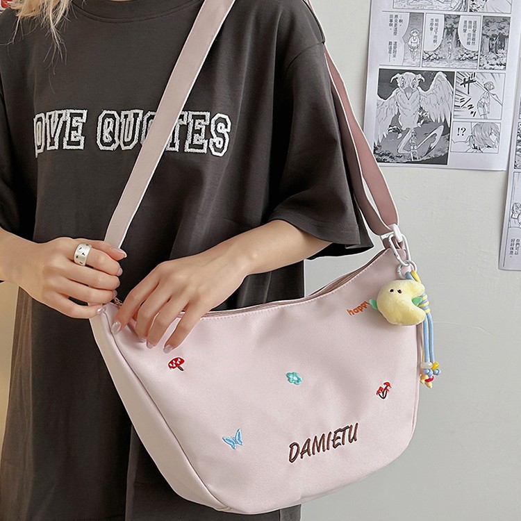 A new high-quality, fresh and cute printed crossbody bag for junior and senior high school students. It is a casual, simple, lightweight and versatile commuting crossbody bag details Picture
