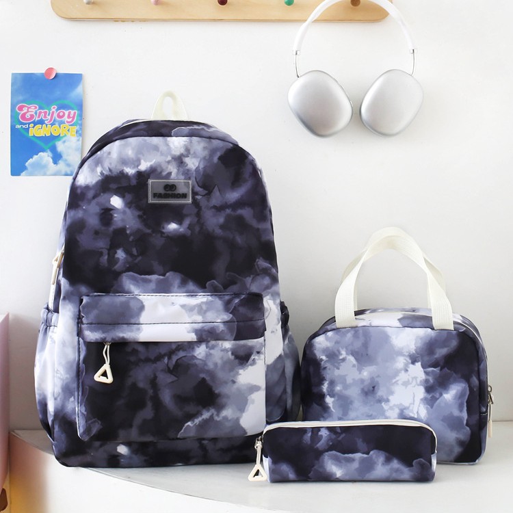 2025 New style nylon schoolbag for primary school students, large-capacity simple backpack for girls, multi-functional tie-dyed school bag full figure