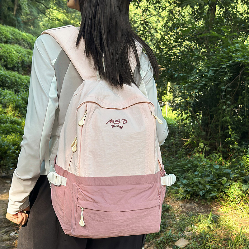 A new high-appearance-level, fresh and sweet color-blocking backpack from Forest-themed ins, a lightweight travel backpack for junior and senior high school students full figure