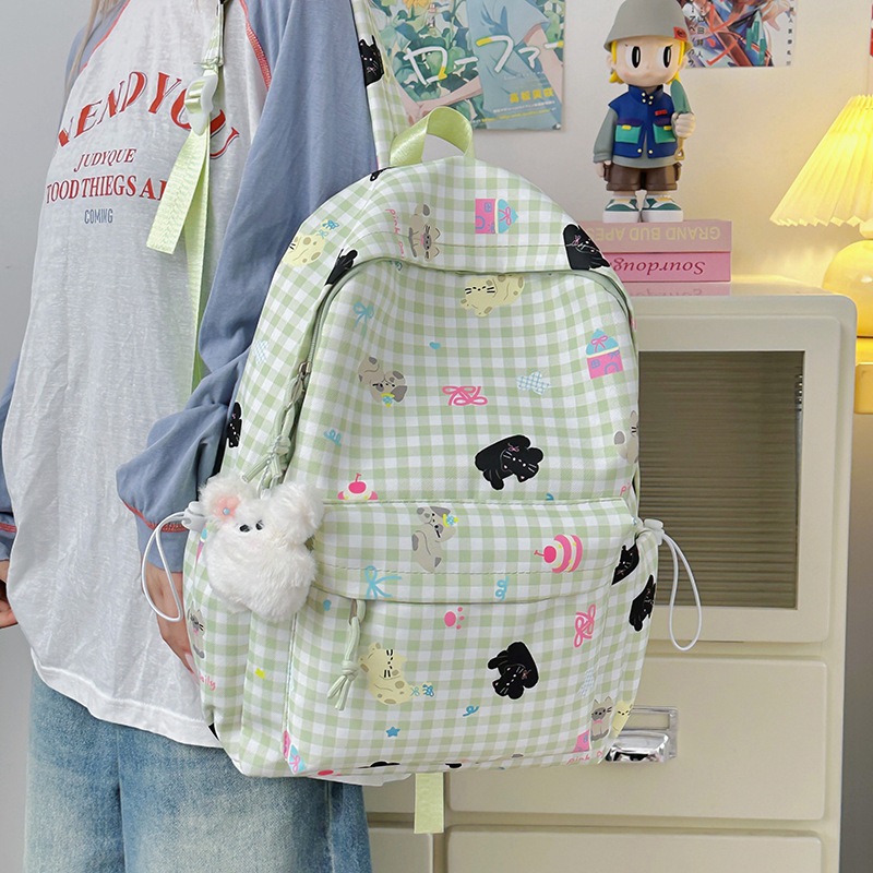 A new high-quality, fresh, sweet and cute printed backpack for junior and senior high school students. It is a casual, simple, lightweight and versatile backpack details Picture