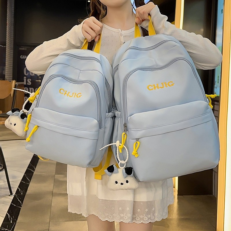 A new Japanese-style ins backpack with a high level of appearance, fresh and cute, candy-colored, simple and lightweight backpack for junior and senior high school students full figure