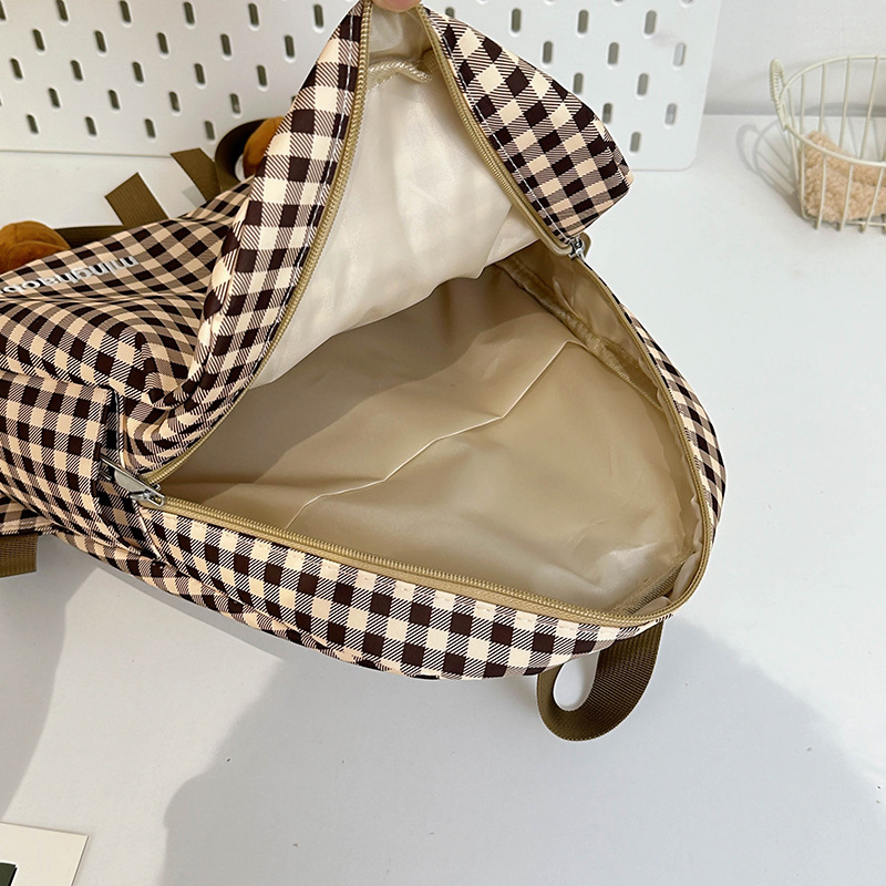 A cute and fresh checkered schoolbag for girls, a cute and ugly cartoon backpack for a small group of students, a lightweight backpack for girls Application Scenario