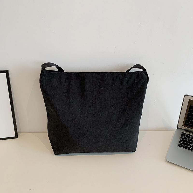 A Japanese-style laid-back casual backpack for commuting, a solid color large-capacity single-shoulder bag with a unique design sense, and a lightweight crossbody bag Application Scenario