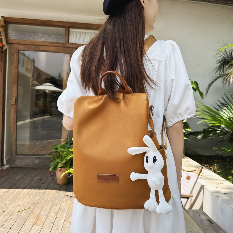 2025 New lightweight and waterproof Mommy Bag, solid color, large capacity, portable backpack for going out, versatile backpack for commuting details Picture