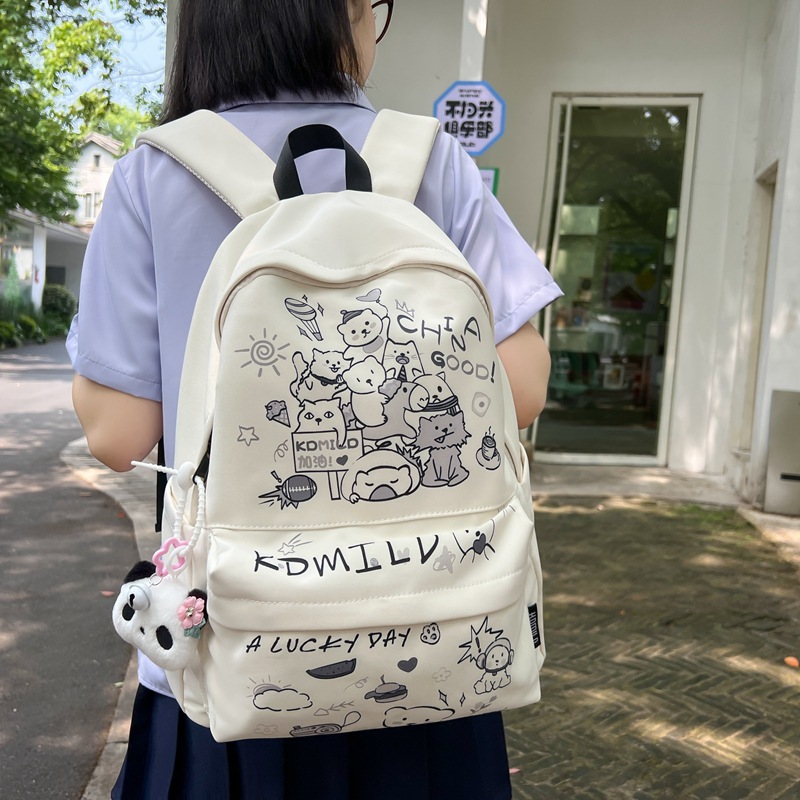 A Japanese-style Instagram niche graffiti schoolbag with high appearance standards, a cute and versatile backpack for junior high school girls, and a lightweight travel backpack details Picture
